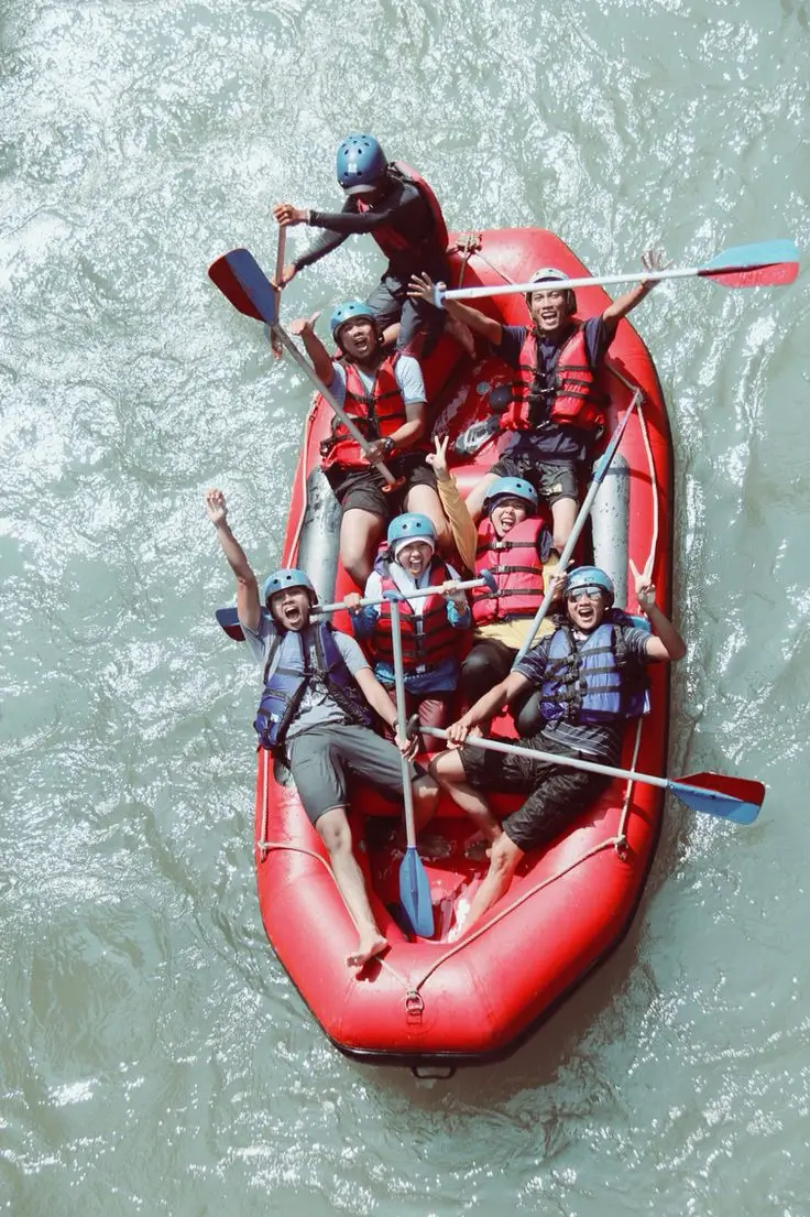 Raft dropping into a Ganga rapid near Rishikesh